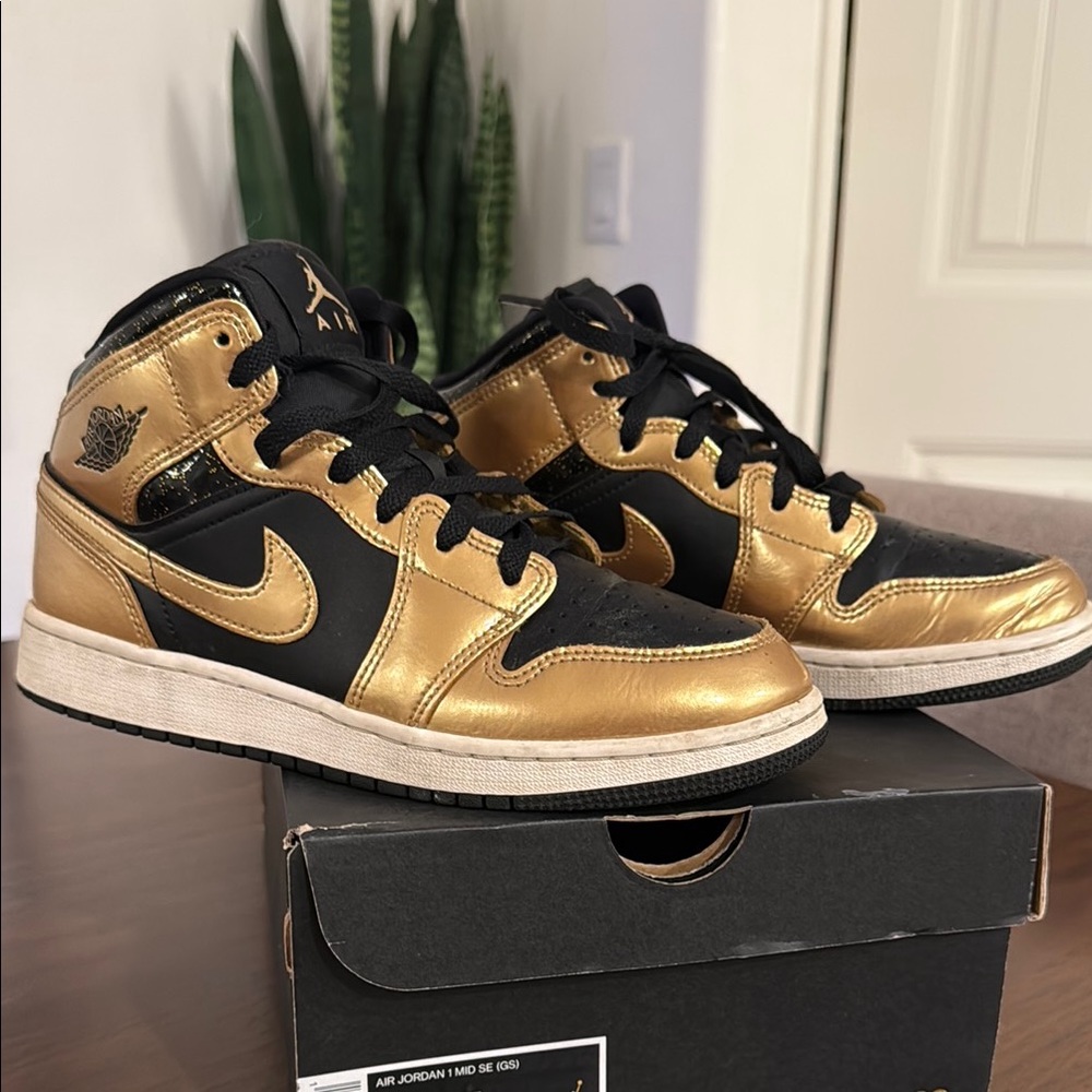Air Jordan Black and Gold Sneakers